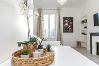 Televízia a/alebo spoločenská miestnosť v ubytovaní MBA Splendide Appart - Le Raincy - Banlieue Paris