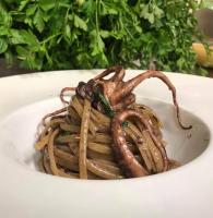 a white bowl filled with a pile of food at Hotel Alex in Florence