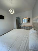 Postel nebo postele na pokoji v ubytování Hotel Anthousa