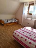 a bedroom with two beds and a window at Les embruns in Petit-Berneval