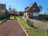 a house with a garden in front of it at Les embruns in Petit-Berneval