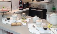 A kitchen or kitchenette at Rami di Corallo Appartamento con Parcheggio Privato ----------