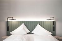 Łóżko lub łóżka w pokoju w obiekcie Stadthotel Goldenes Schiff