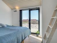 Postel nebo postele na pokoji v ubytování Holiday Home Aiko - 50m from the sea by Interhome