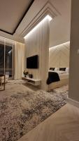 Televízia a/alebo spoločenská miestnosť v ubytovaní Apartament Bulwary Oświęcim