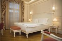 Postel nebo postele na pokoji v ubytování Corinne Art & Boutique Hotel