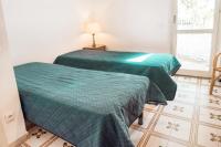 A bed or beds in a room at M224 - Marcelli, trilocale con giardino a 150mt dal mare