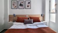 A bed or beds in a room at Apartamento Torre Buena Vista