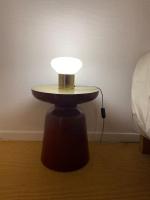 a lamp on a table in the corner of a bedroom at Loft&#47;jardin et parking : Le Petit Clos Bourdet in Honfleur