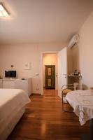 Łóżko lub łóżka w pokoju w obiekcie B&b Villa Maria Di Venere