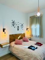 Posteľ alebo postele v izbe v ubytovaní Coqueto apartamento céntrico con piscina