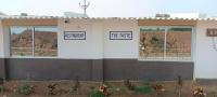 a building with two signs on the side of it at Govind Niwas Homestay in Jagdalpur