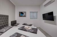 Televízia a/alebo spoločenská miestnosť v ubytovaní Crikvenica Apartment 18