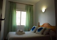 Posteľ alebo postele v izbe v ubytovaní Apartamentos Bellavista Bolonia