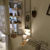 a bedroom with a bed and a lamp and a window at Mon rêve in Les Martys