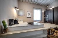 A kitchen or kitchenette at Hs4U Ricasoli Luxury apartment near Duomo N.2