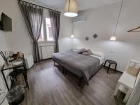 Łóżko lub łóżka w pokoju w obiekcie Residenza Tarzanà