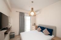 A bed or beds in a room at Saint Francis Apartment