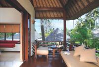 a living room with a couch and a table at Qunci Villas Resort in Senggigi