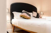 A bed or beds in a room at Fiesolana Elegant