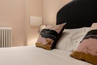 A bed or beds in a room at Fiesolana Elegant