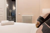 A bed or beds in a room at Fiesolana Elegant