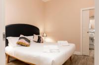 A bed or beds in a room at Fiesolana Elegant