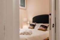 A bed or beds in a room at Fiesolana Elegant