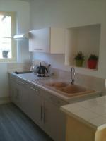 a kitchen with a sink and a counter top at Vaste appartement avec vue sur la Vienne in Chinon