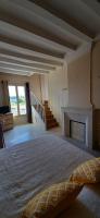 a large bedroom with a bed and a fireplace at Vaste appartement avec vue sur la Vienne in Chinon