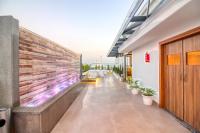 a hallway of a building with a brick wall at SJ PARADISE in Dehradun