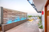 a balcony of a building with a retaining wall at SJ PARADISE in Dehradun