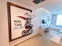 a room with a painting of a rabbit riding a bike at Beat Hotel Bangkok in Bangkok