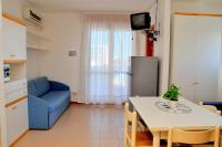 A seating area at Seafront view studio in Bibione - Beahost