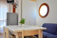 A seating area at Seafront view studio in Bibione - Beahost