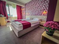 A bed or beds in a room at Hotel Rila