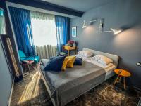 A bed or beds in a room at Hotel Rila