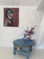 a painting and a table in front of a painting at Campagne Salettes in Lorgues