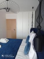 Posteľ alebo postele v izbe v ubytovaní Sunset207 Apartament Premium - Westin House Resort w Kołobrzegu