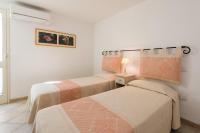 A bed or beds in a room at Apartment in S'Abba e Sa Pedra with pool