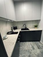 Kuchyňa alebo kuchynka v ubytovaní Wileńska home apartment 3