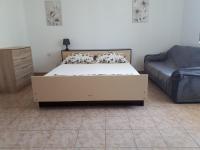 Postel nebo postele na pokoji v ubytování Anic Apartments Stanići