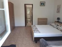 Postel nebo postele na pokoji v ubytování Anic Apartments Stanići