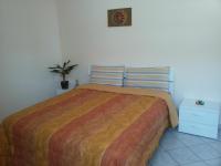 Posteľ alebo postele v izbe v ubytovaní Conte Caramelli Apartment