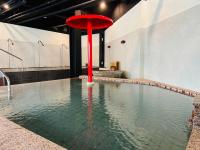 a swimming pool with a red object in the water at Tangyue Resort in Tai&#39;an