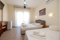 Postel nebo postele na pokoji v ubytování Hotel Alkyon