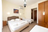 Postel nebo postele na pokoji v ubytování Hotel Alkyon