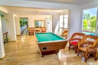 a room with a pool table and chairs at COMPLEX TISMANA 3* ALL INCLUSIVE in Jupiter