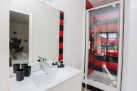 a bathroom with a white sink and a mirror at Hostellerie LE PANEL in Mandelieu-La Napoule