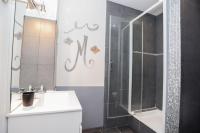 a bathroom with a shower and a white sink at Hostellerie LE PANEL in Mandelieu-La Napoule